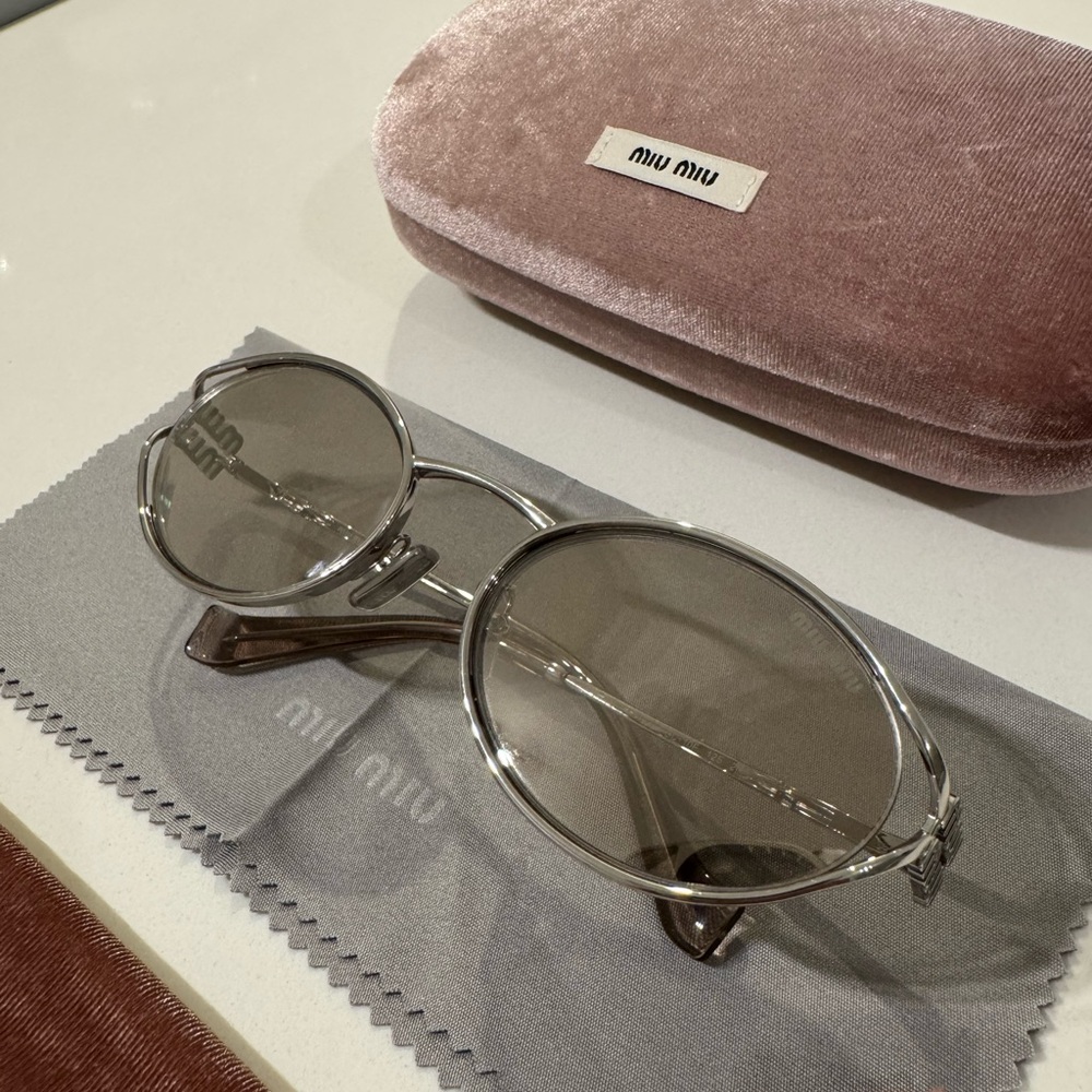 Miu Miu Logo Oval Sunglasses in Light Gold/Silver